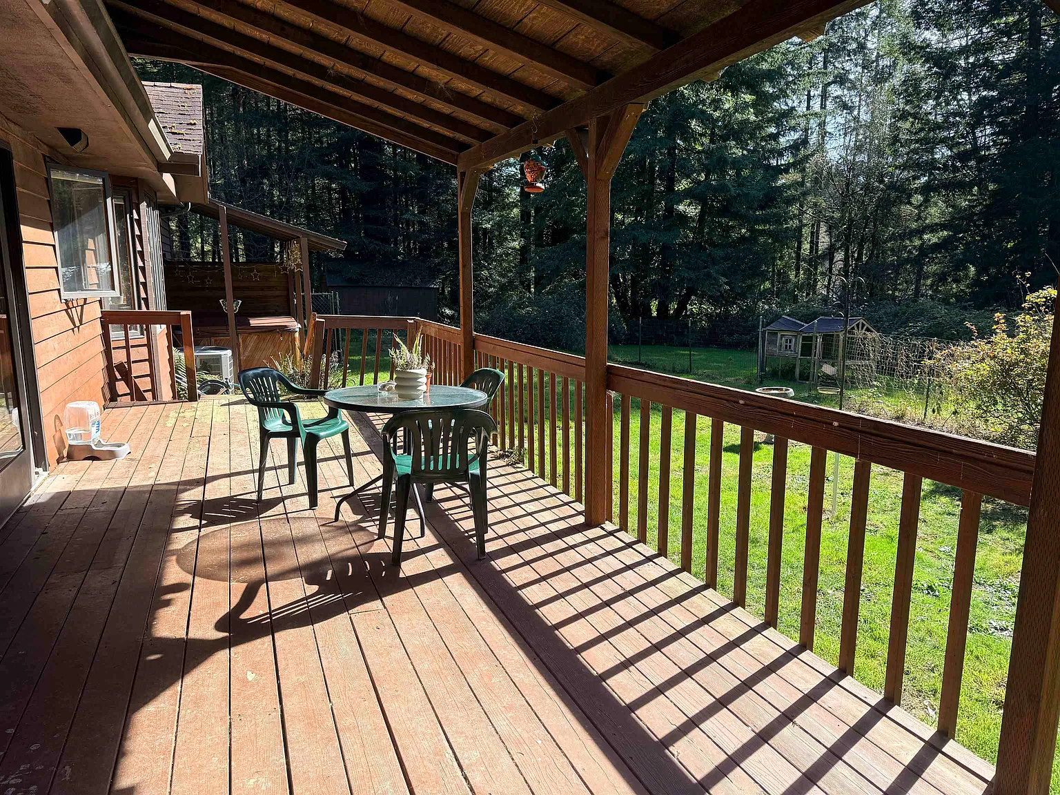 Deck looking out over the yard and redwoods.